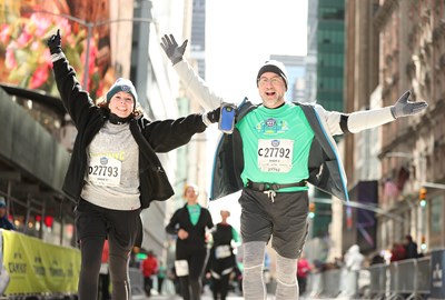 Runners at the 2019 United Airlines NYC Half make their way through Times Square